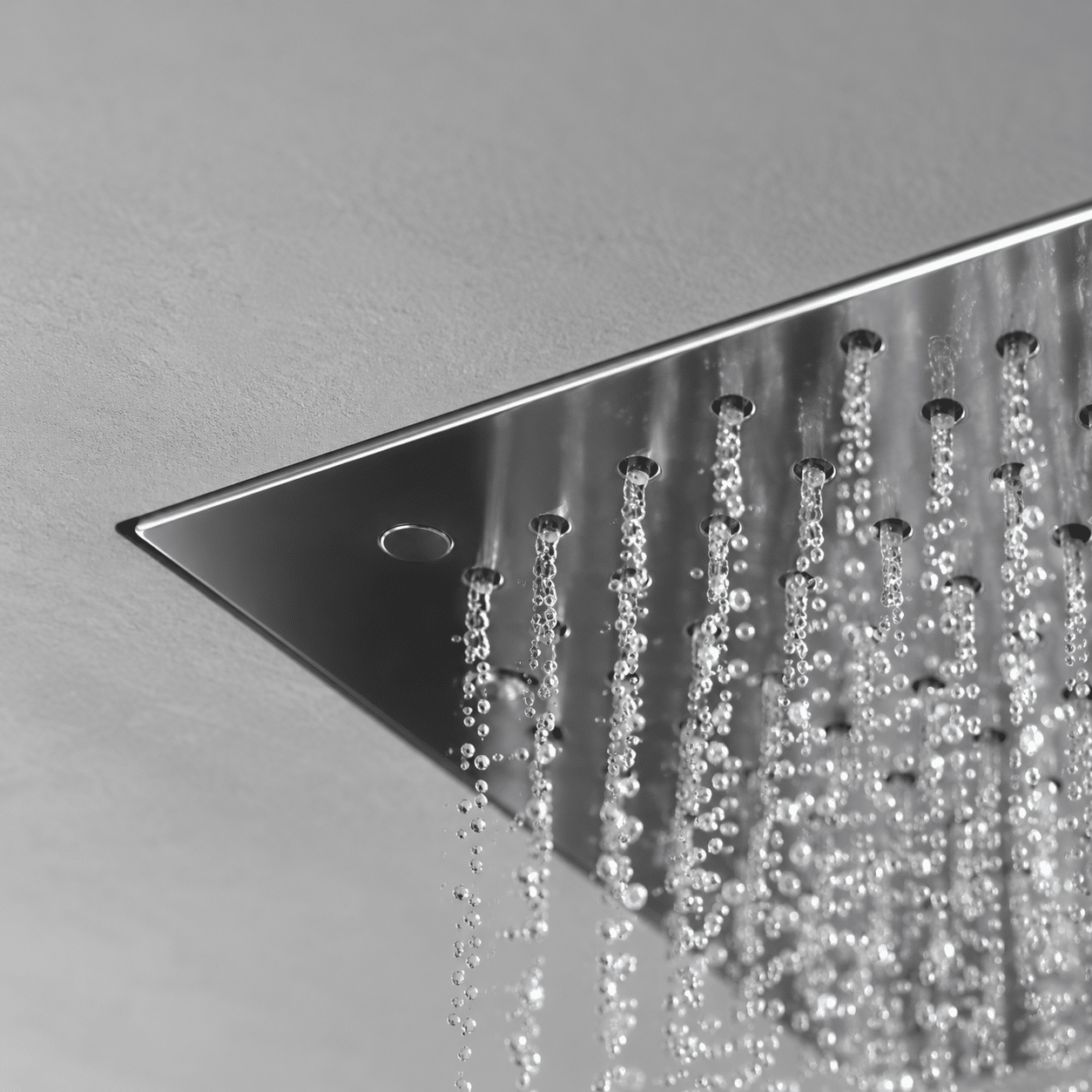 Concealed ceiling-mounted rainfall showerhead utilizing air-injection nozzles, representing Skyland luxury shower systems matrix.