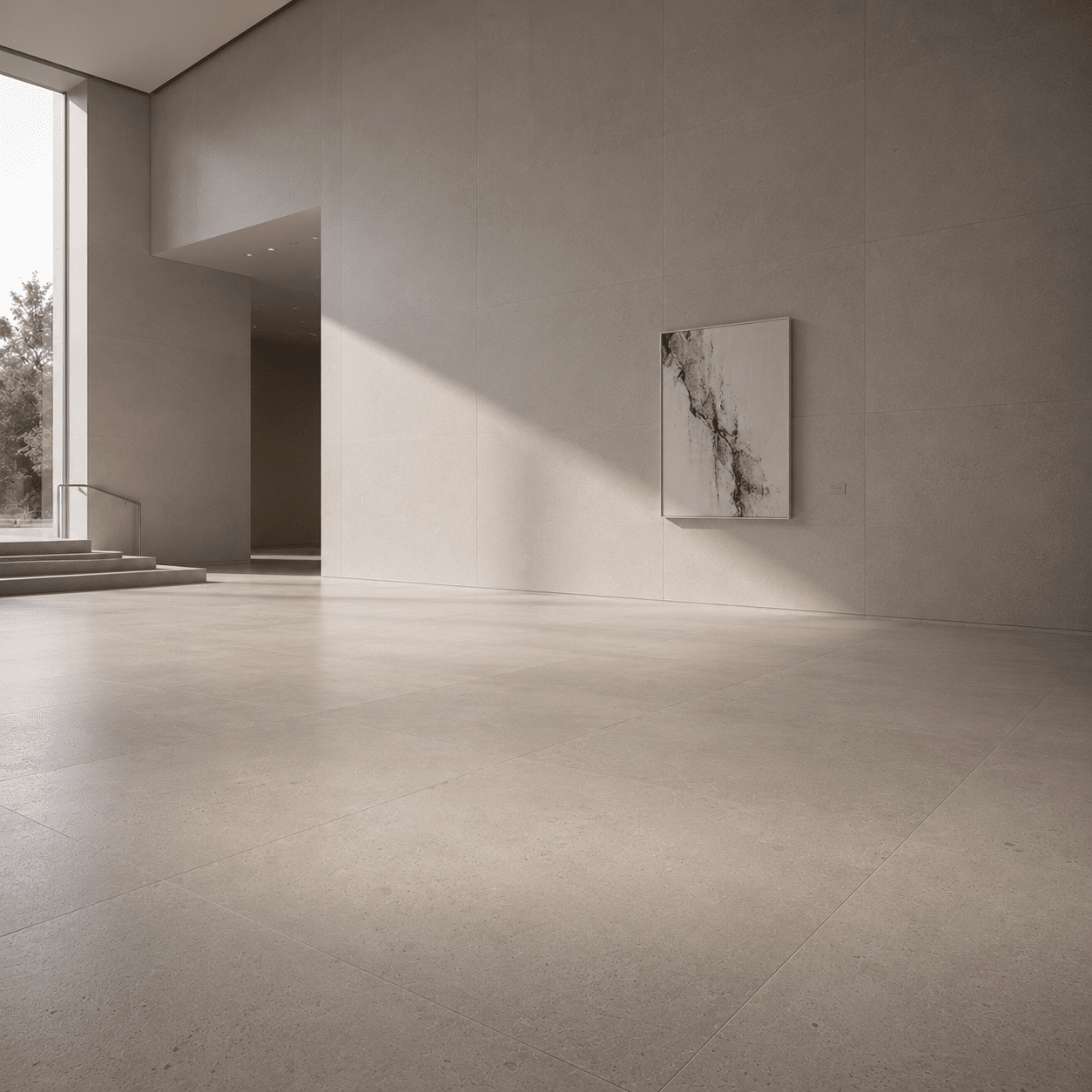 Seamless interior floor and wall claddings executed via premium architectural limestone supply within a minimalist modern art gallery.
