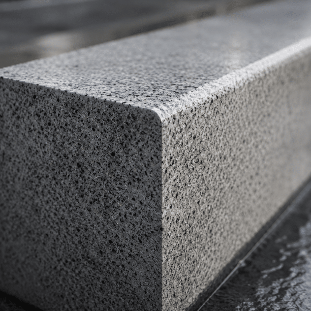Bespoke solid stone kerbs and infrastructure blocks fabricated using heavy-duty granite project supply lines.