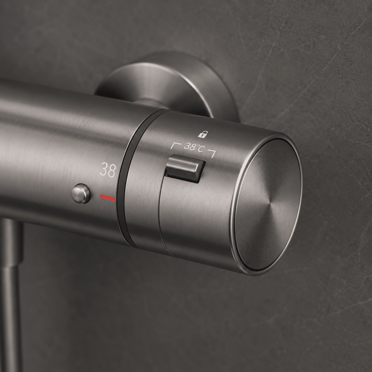 Thermostatic exposed anti-scald mixer valve finished in brushed gunmetal under luxury shower systems portfolio.