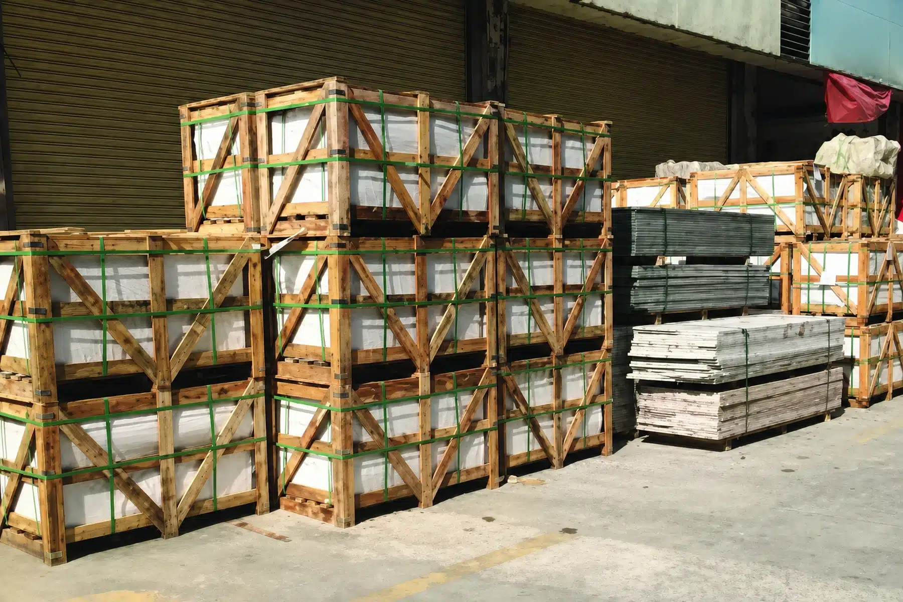 Crated building materials grouped in a warehouse consolidation area