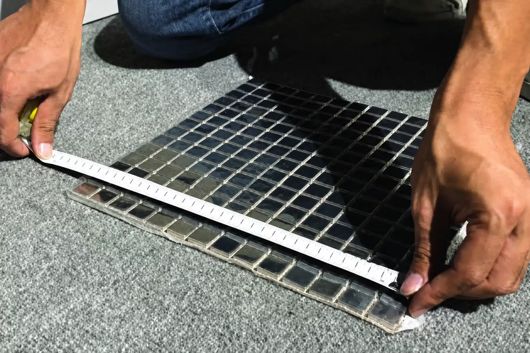 Inspector measuring a finished building material component against an agreed requirement
