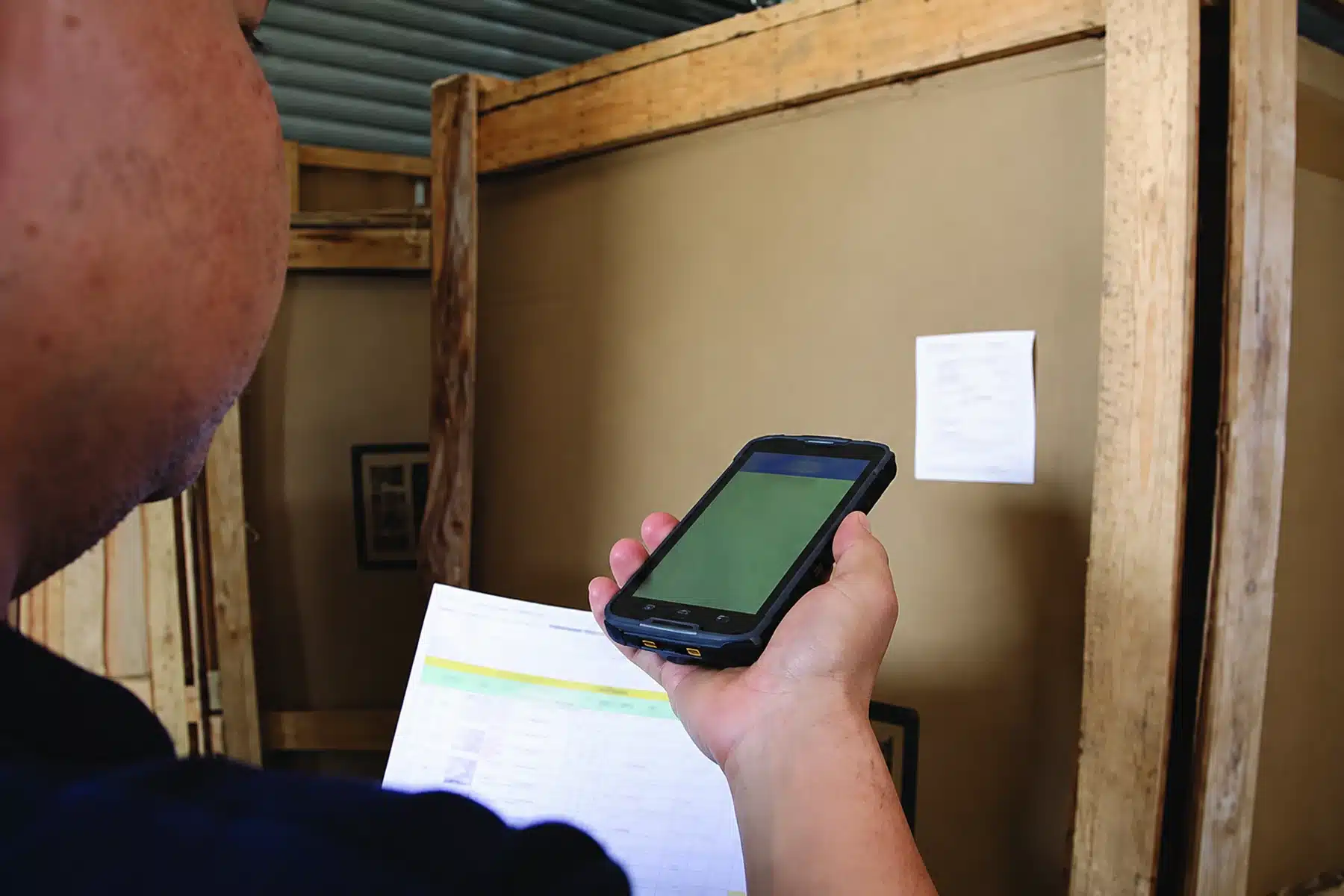 Warehouse staff scanning a package during building material goods receipt